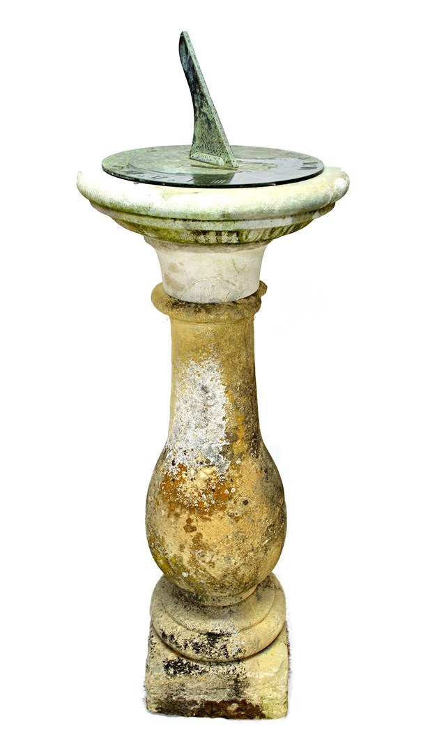 Appraisal: A carved sandstone baluster shaped sundial the circular bronze top