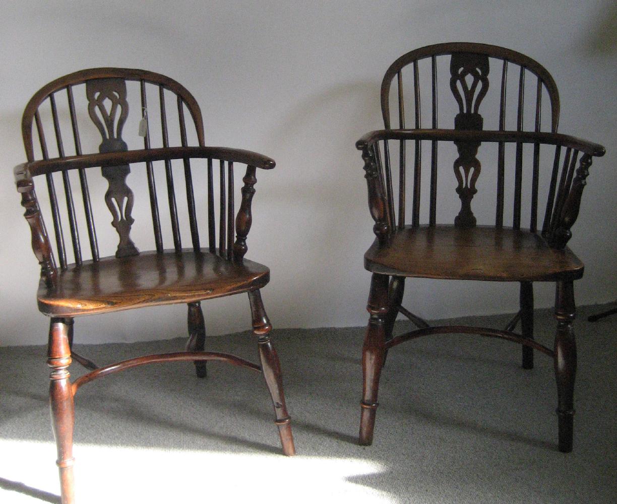 Appraisal: A PAIR OF VICTORIAN YEW WINDSOR ARMCHAIRS of low double