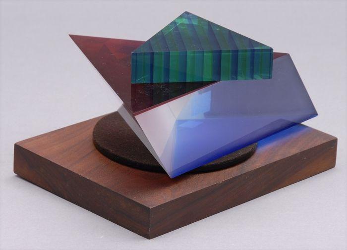 Appraisal: TWO LUCITE STACKING TRIANGLES ON ROTATING STAND Overall x in