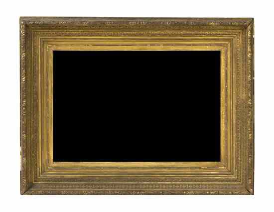 Appraisal: A Victorian Giltwood Mirror the rectangular beveled plate within a