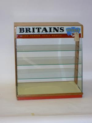 Appraisal: A Britains stained wood glass fronted display cabinet with four