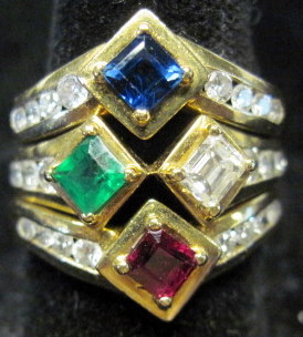 Appraisal: karat diamond sapphire ruby and emerald stacking ringsThree rings one