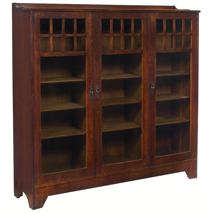 Appraisal: Lifetime bookcase three-door form with overlaid mullion design at top