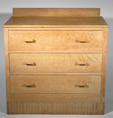 Appraisal: An English limed oak chest of drawers in the style