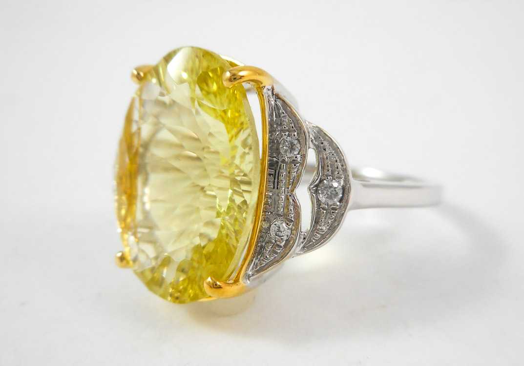 Appraisal: LEMON TOPAZ DIAMOND AND FOURTEEN KARAT GOLD RING The white