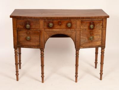 Appraisal: A George IV mahogany bowfront kneehole sideboard fitted a central