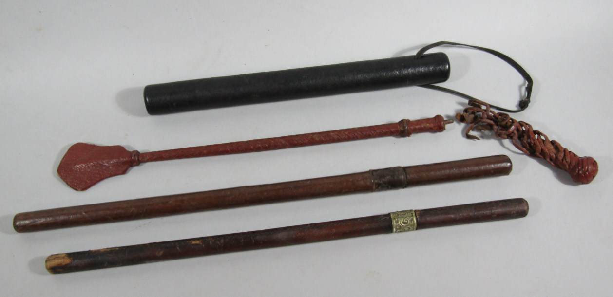 Appraisal: Two antique short sword sticks baton and solid plaited riding