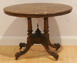 Appraisal: A Victorian walnut and inlaid loo table cm long cm