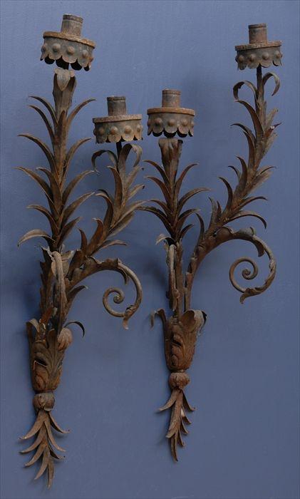 Appraisal: PAIR OF ROCOCO-STYLE WROUGHT IRON TWO-LIGHT WALL APPLIQUES Each tiered