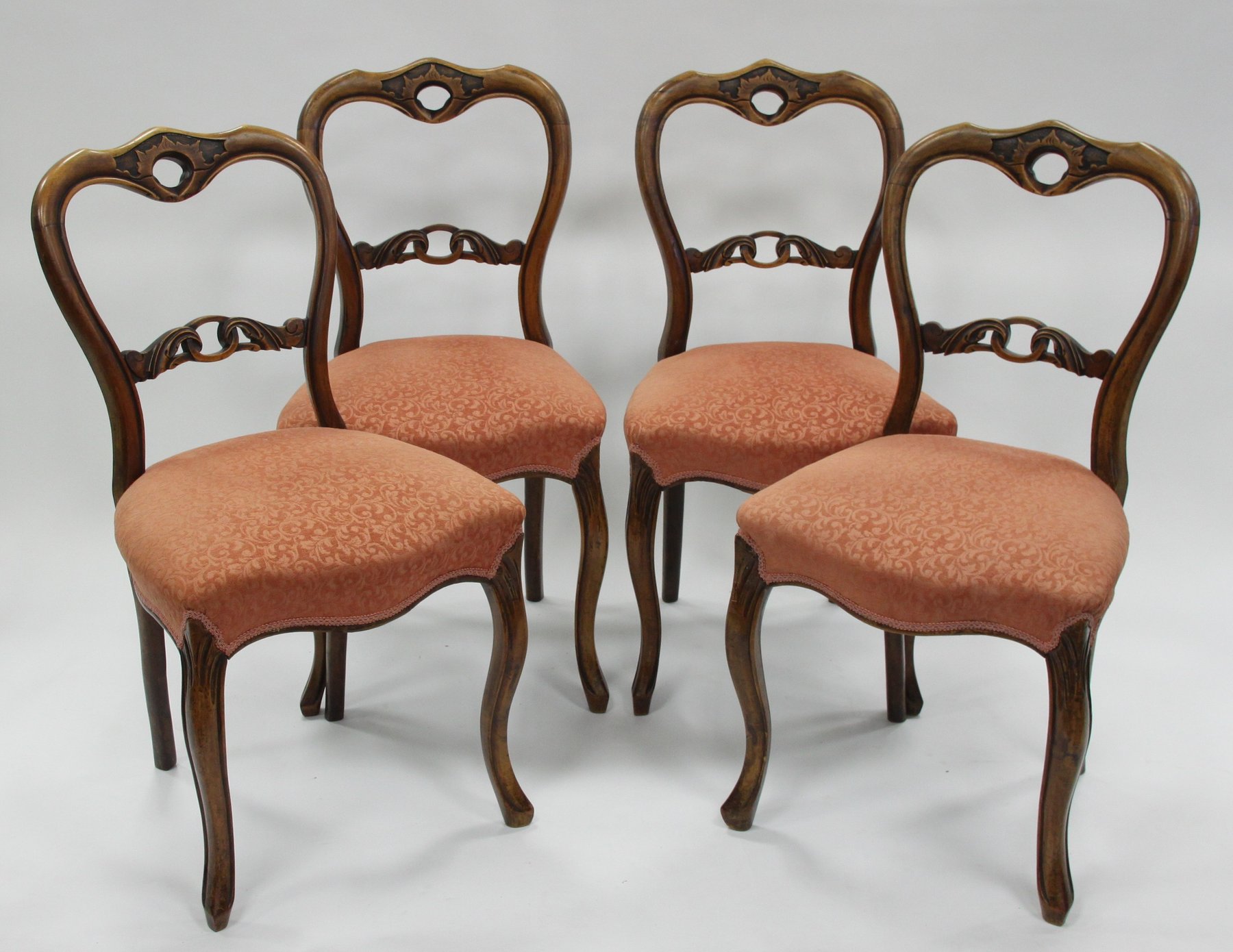 Appraisal: Four Victorian walnut single chairs with oval backs and upholstered