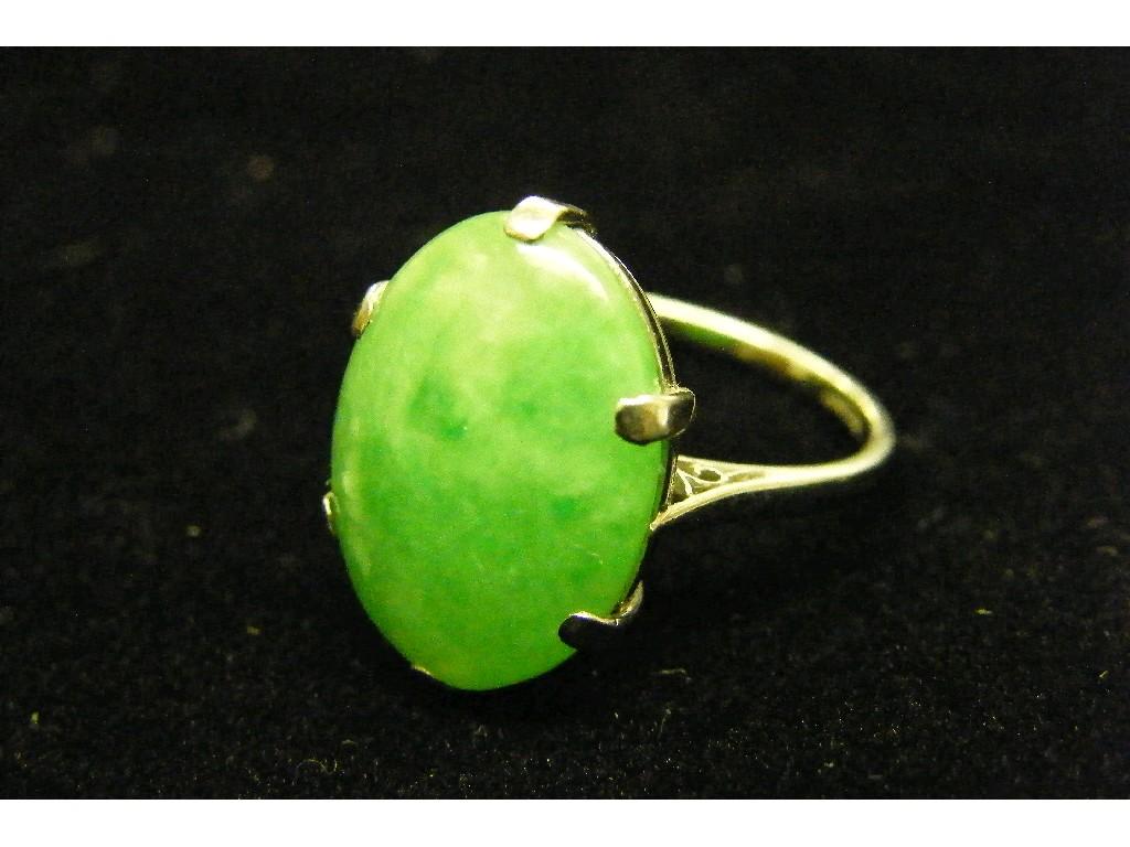 Appraisal: Platinum oval jade set ring in a pierced claw setting