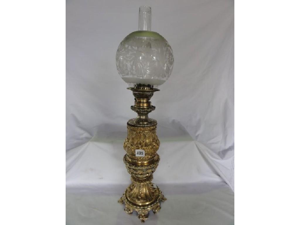 Appraisal: A Victorian gilt brass oil lamp with embossed geometric detail