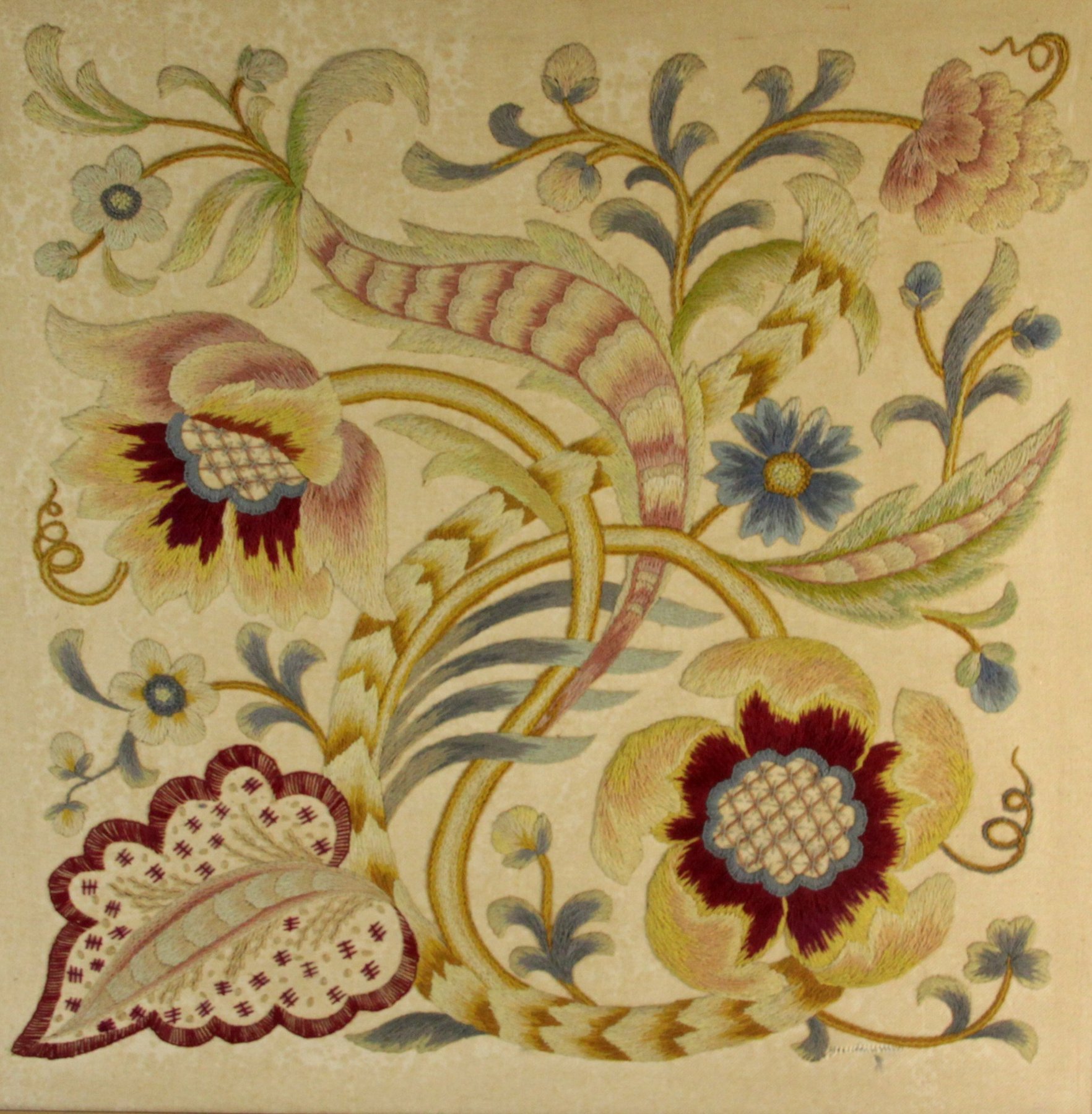 Appraisal: A needlework panel depicting foliate scrolls in a wooden frame