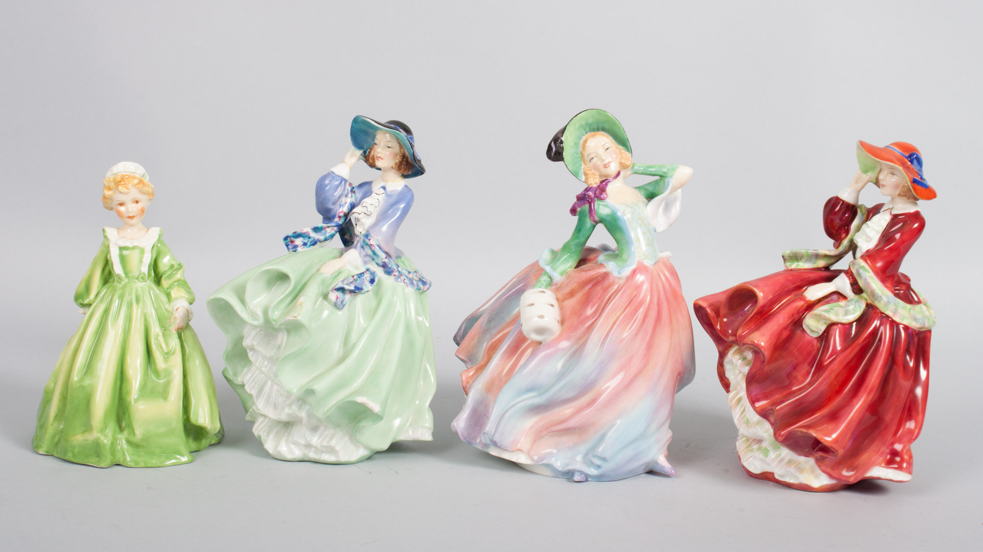 Appraisal: Four Royal Doulton Royal Worcester china figures three Royal Doulton