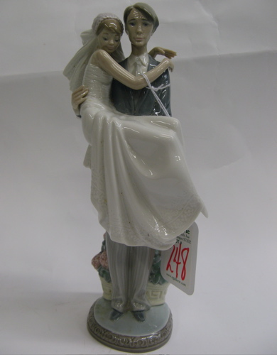 Appraisal: LLADRO GLAZED PORCELAIN FIGURINE Over The Threshold a groom carrying