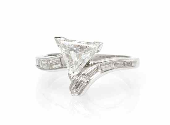 Appraisal: A Platinum and Diamond Ring containing one triangular step cut