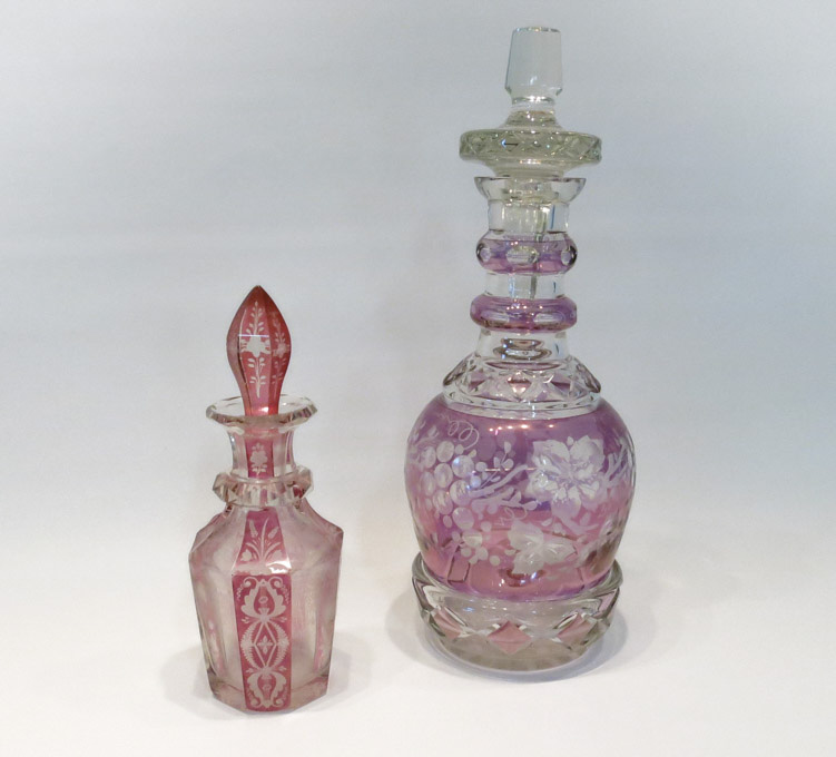 Appraisal: TWO FLASH CUT-TO-CLEAR DECANTERS the larger decanter in a purple