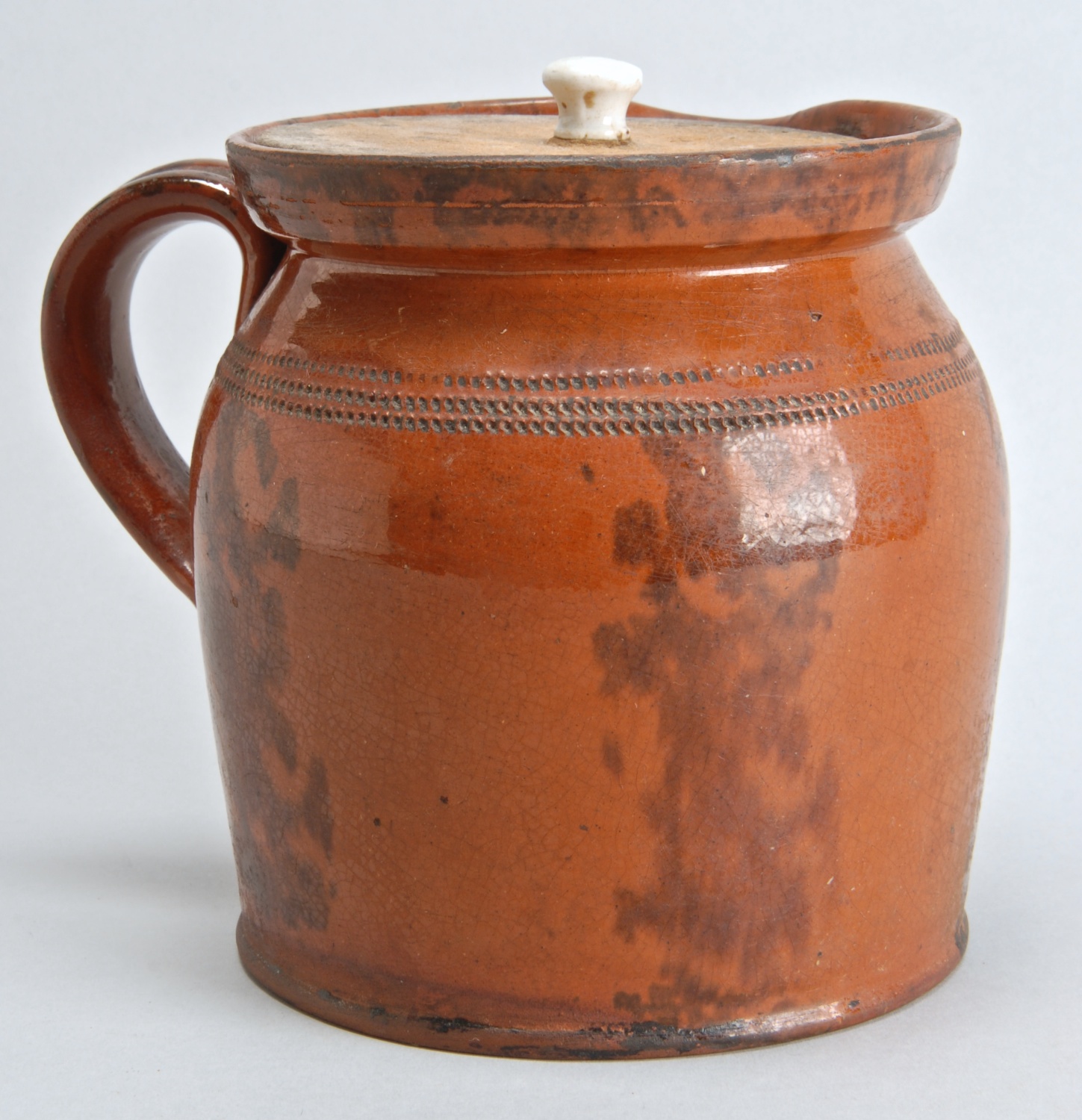 Appraisal: TH CENTURY OHIO REDWARE POURING JUG with vertical deep brown