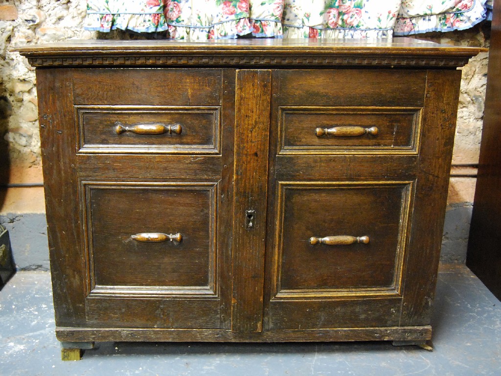 Appraisal: A th century oak chest the top formed of two