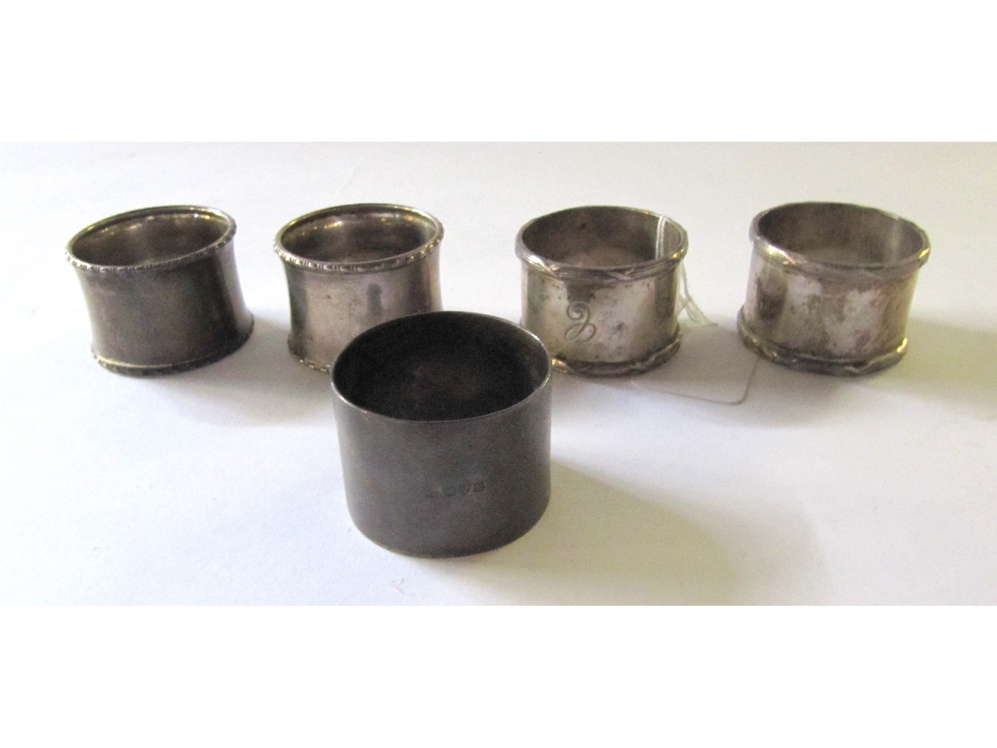 Appraisal: A lot comprising two pairs of silver napkin rings and