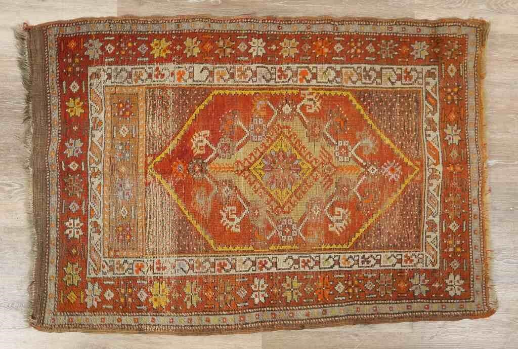 Appraisal: Anatolian rug th century Fringed edges with large diamond medallion