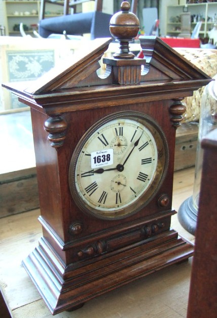 Appraisal: A Junghaus walnut cased mantel clock with architectural case and