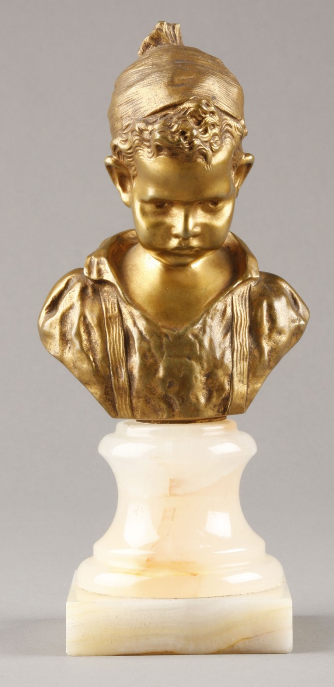 Appraisal: Small bronze bust of a young boy wearing cap on