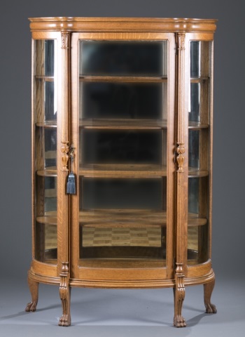 Appraisal: th c Oak Curio Cabinet Curved glass carved columns flanking