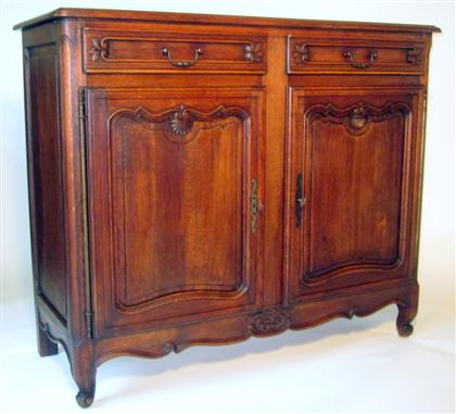 Appraisal: Louis XV style provincial oak buffet The rectangular top over