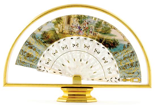 Appraisal: French painted and mother-of-pearl fan circa brass-mounted and pierce-carved guard