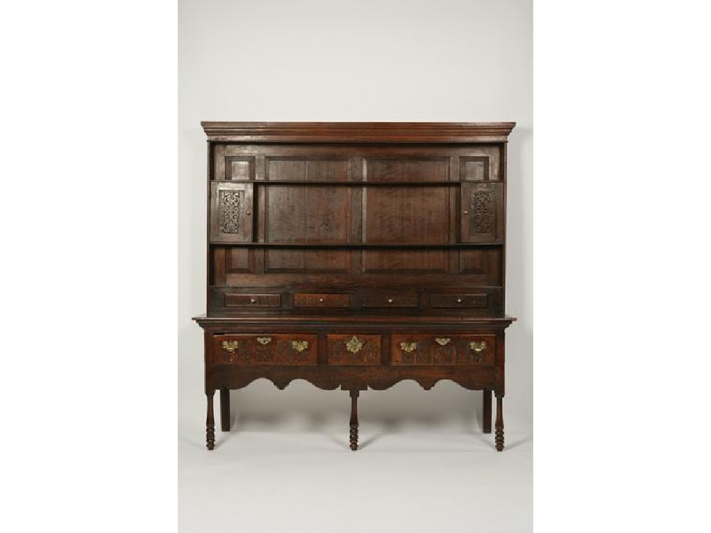 Appraisal: A GEORGE III STYLE OAK DRESSER the raised back with