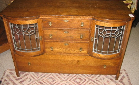 Appraisal: A VICTORIAN OAK CHINA BUFFET American c the front centering