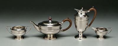 Appraisal: Four-piece English silver tea service round bodies pedestal bases scroll