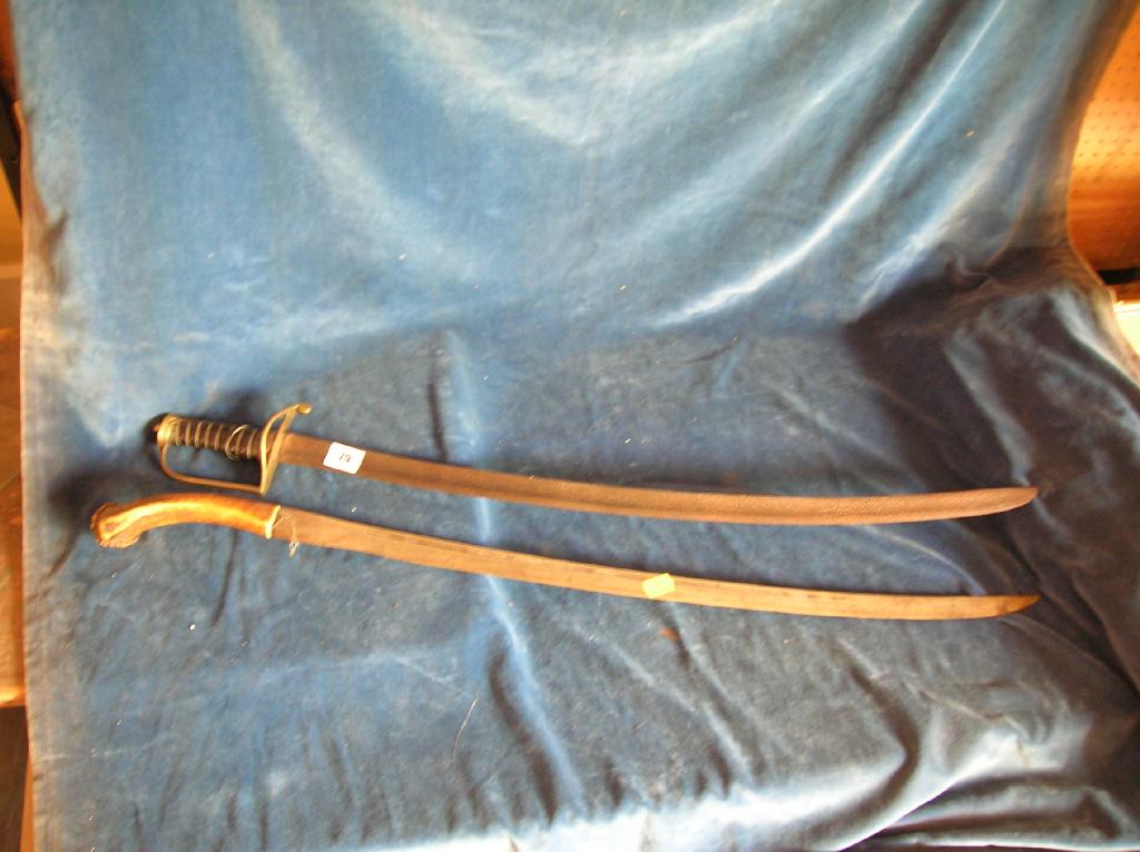 Appraisal: A late th century sabre with brass stirrup hilt grooved