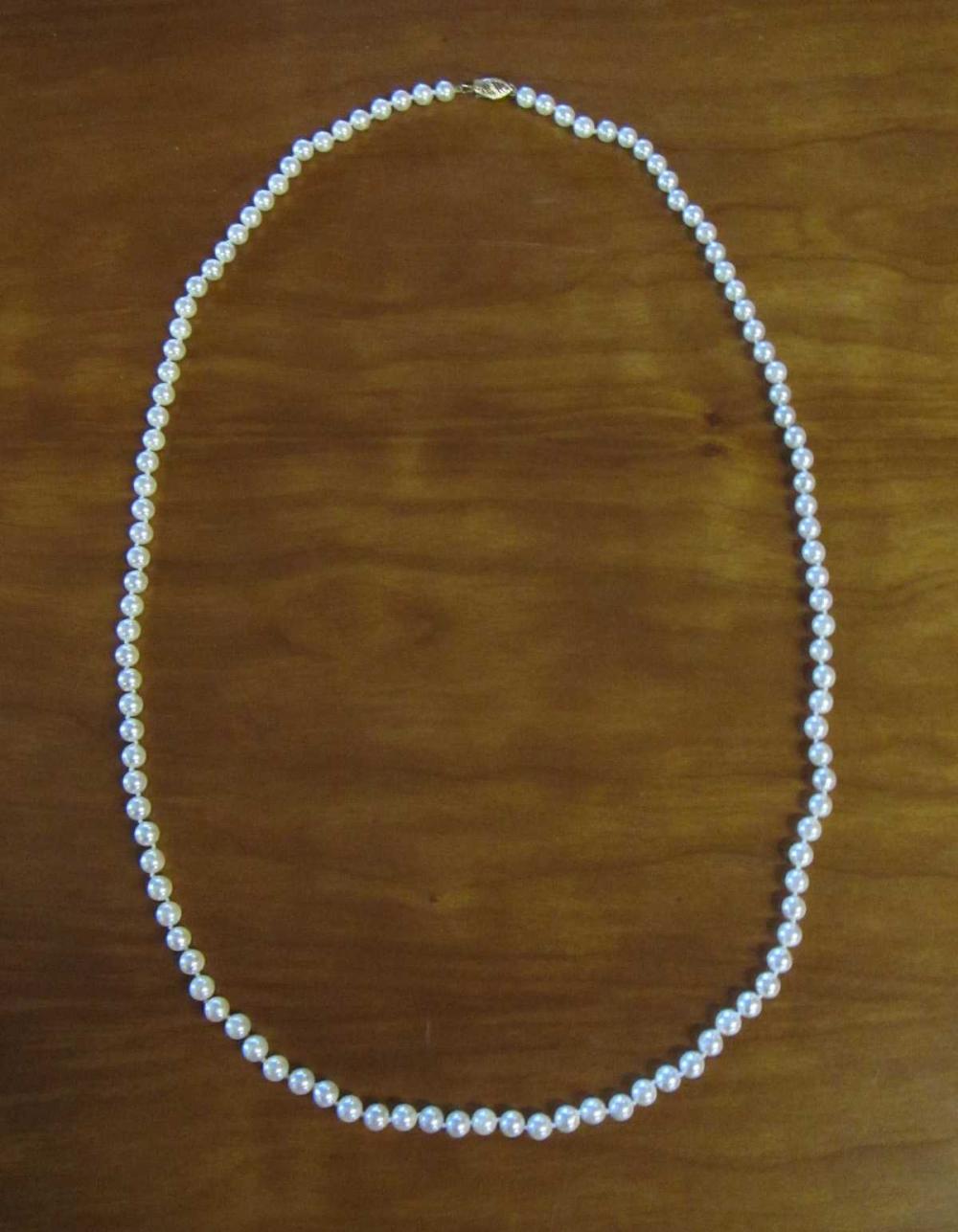 Appraisal: OPERA LENGTH WHITE PEARL AND FOURTEEN KARAT GOLD NECKLACE -