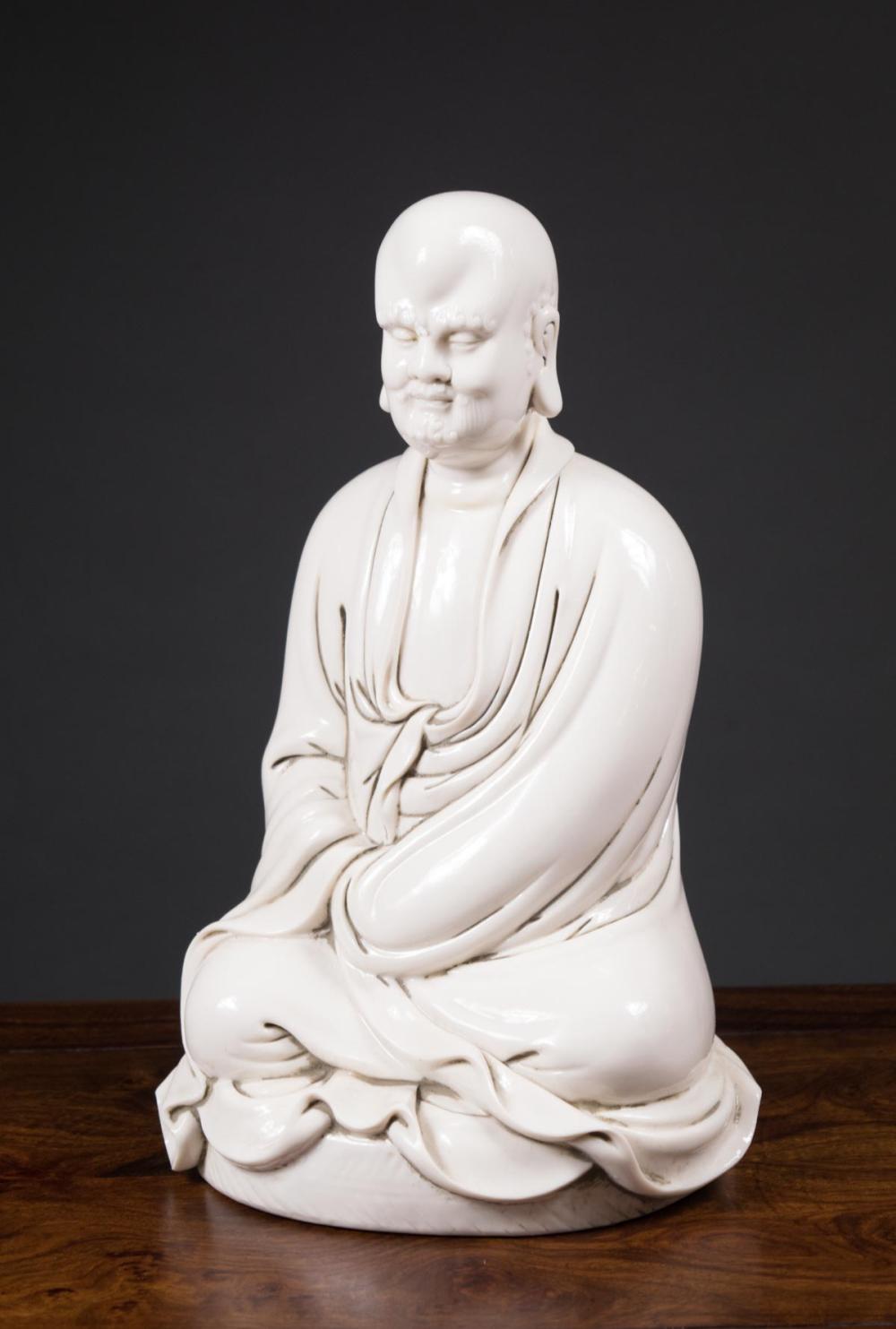 Appraisal: CHINESE BLANC DE CHINE LUOHAN SCULPTURE in seated pose unmarked