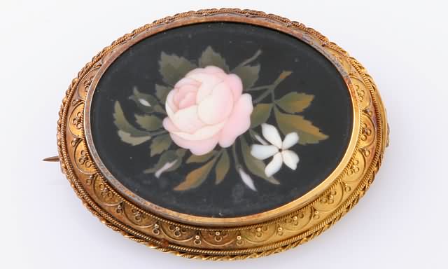 Appraisal: KY Brooch with brass pin X oval frame Floral motif