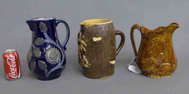 Appraisal: Lot early pitchers including German Rockingham glaze folky example with