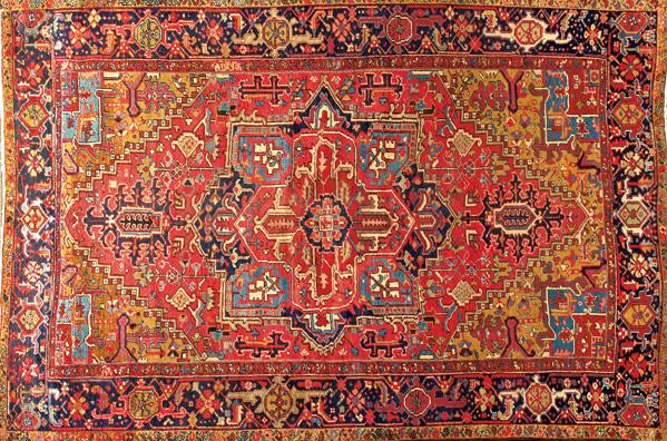 Appraisal: PERSIAN HERIZ Room-size rug with central medallion on rose and