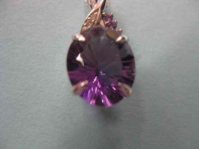 Appraisal: Amethyst Diamond Pendant carat vividcut oval gem with diamonds amethysts