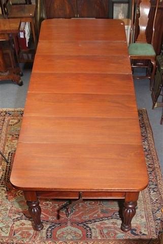 Appraisal: AN EARLY VICTORIAN MAHOGANY EXTENDING DINING TABLE with five additional