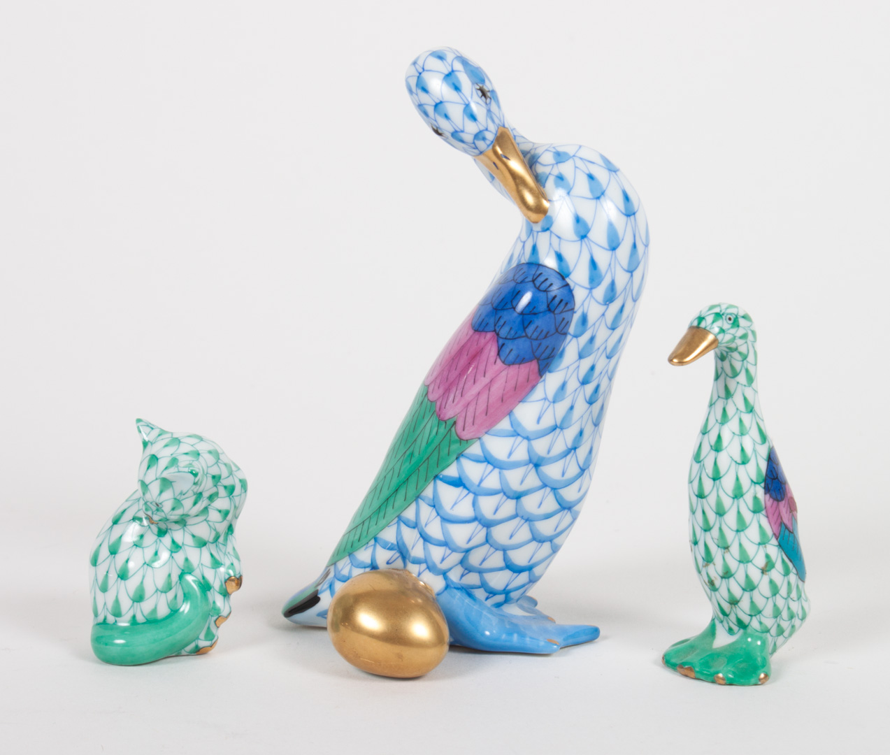 Appraisal: Three Herend porcelain animals goose with golden egg in blue