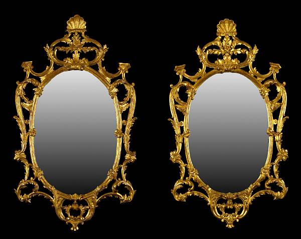 Appraisal: A pair of George III style giltwood oval mirrors fourth