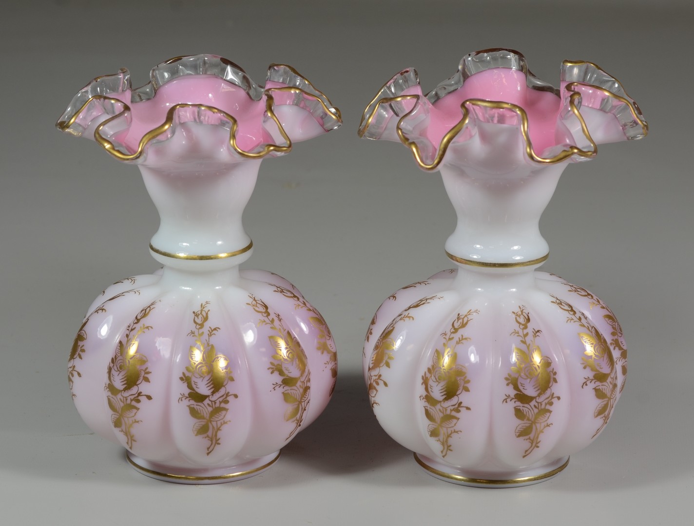 Appraisal: Pair of pink and white case glass ruffled vases with