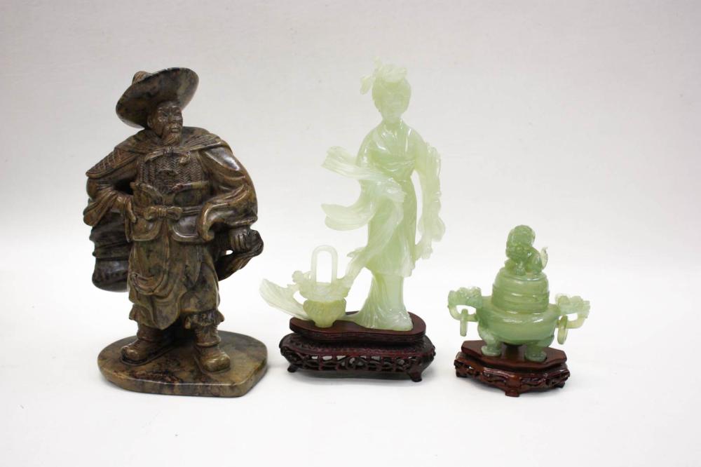 Appraisal: THREE CHINESE HARDSTONE SCULPTURES depicting a standing Guanyin figure raised