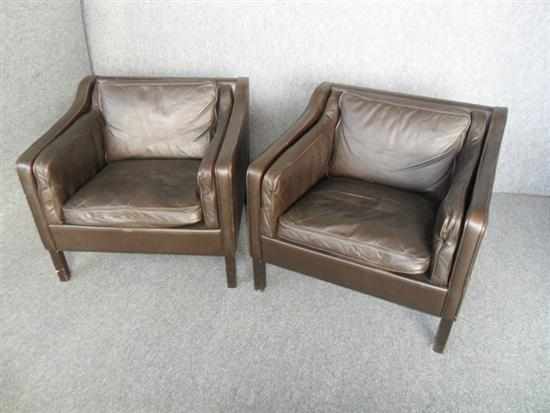 Appraisal: A PAIR OF DANISH DARK BROWN LEATHER ARMCHAIRS raised on