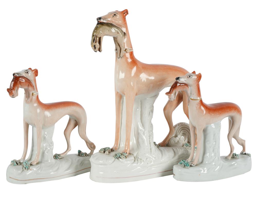 Appraisal: THREE STAFFORDSHIRE POTTERY DOG FIGURESunmarked Provenance The Estate of Kay