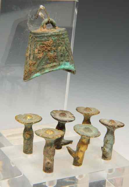 Appraisal: SIX CHINESE HAN DYNASTY BRONZE TENT PEGS and a bell