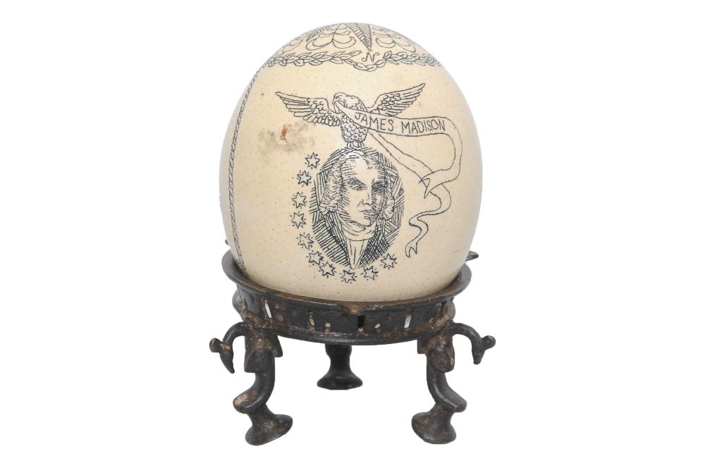 Appraisal: SCRIMSHAW OSTRICH EGG ON STANDdepicting a portrait of James Madison