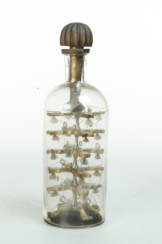 Appraisal: BOTTLE WHIMSEY American late th century glass wood and thread